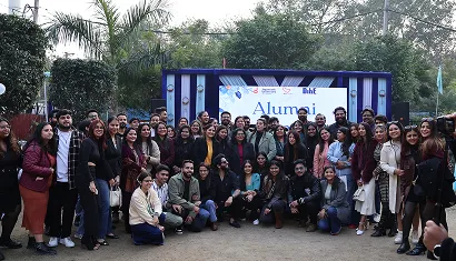 A batch of alumni posing together for a photo
