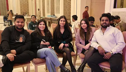 A batch of alumni posing together for a photo