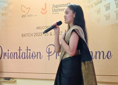 alumni speaking at the orientation meet